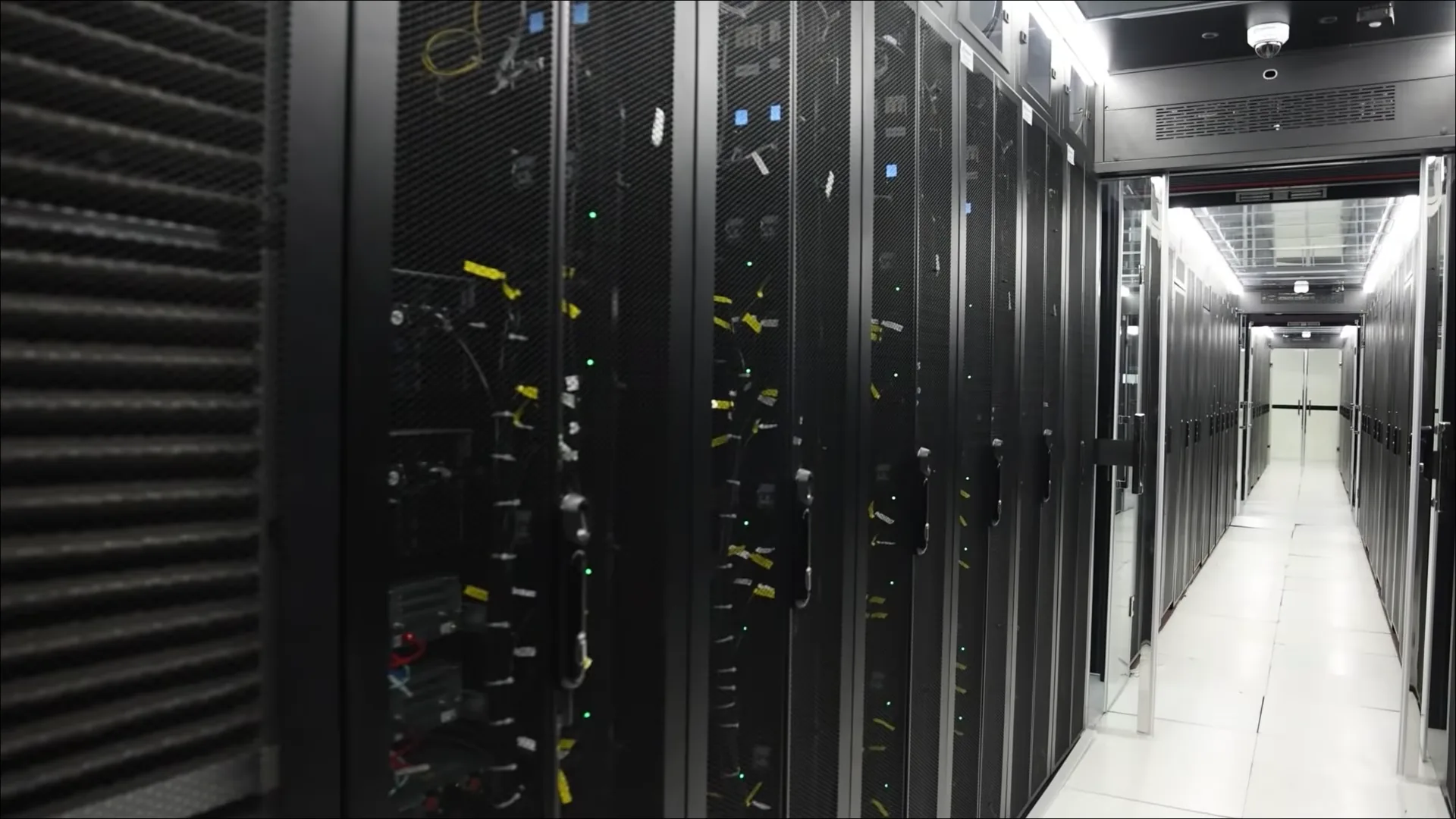A rack row inside Ethio Telecom's Bole data center, cabinets on the left and a lit aisle running to the far end.